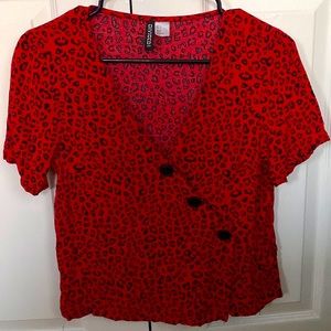 Red leopard button top